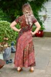Boho maxi dress with colorful design in red, and golden nuances