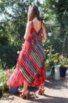The back of a red summerdress with stripes and floral print. Loose and airy look