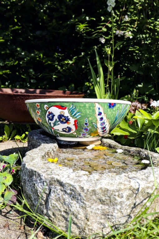 Turkish handmade ceramic handicraft in olive-green with adorable motifs in various color combinations. Ottoman style bowl.