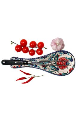 Leadfree handmade spoon rest in ceramics. Sturdy elegant design with floral motifs on a white backdrop