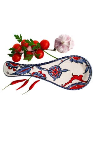 Ceramic spoon holder perfect for resting your kitchen cutlery while cooking. Colorful floral design in blue, red, white and purple