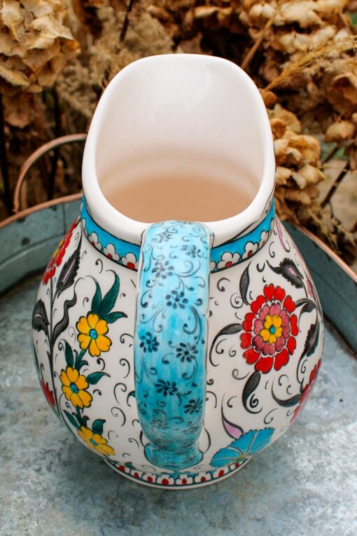 Keramikkande med hank, bort og blomstermotiver